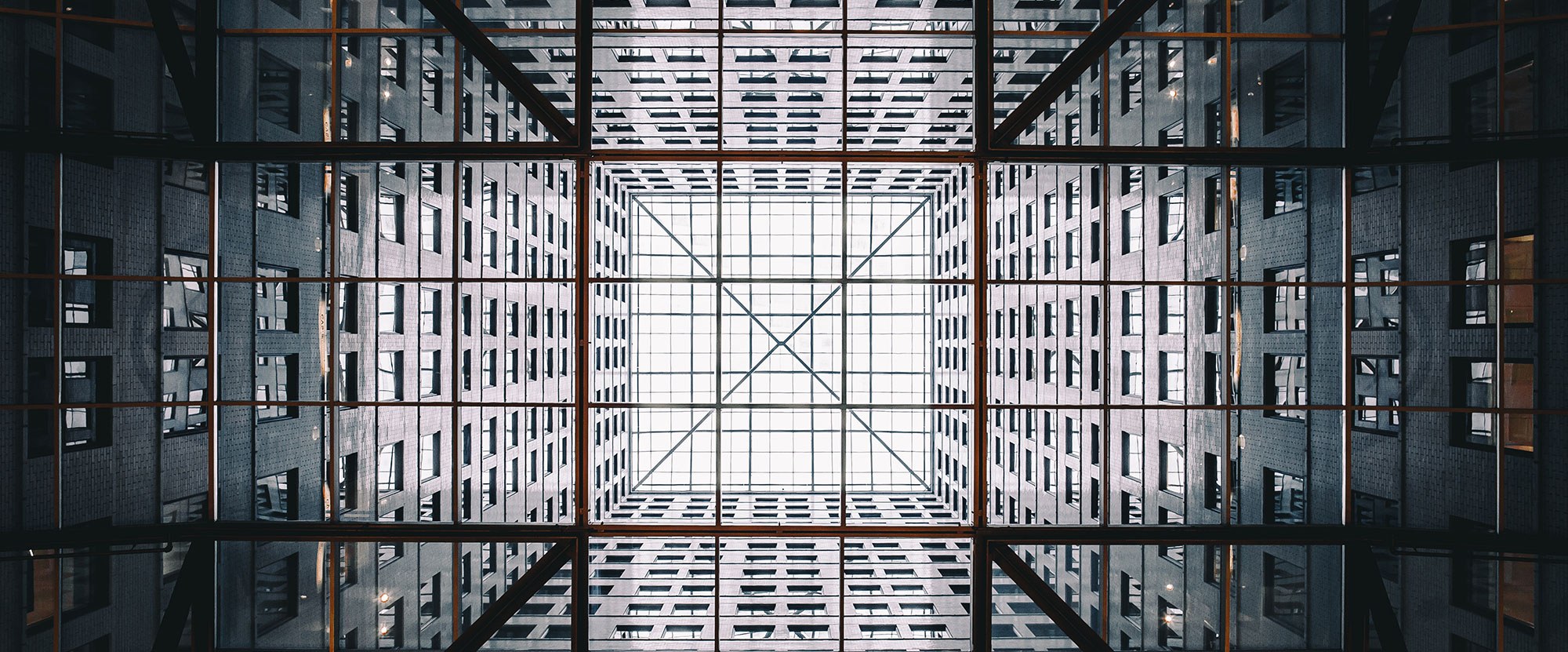 Abstract Image looking up in center of a complex of office buildings