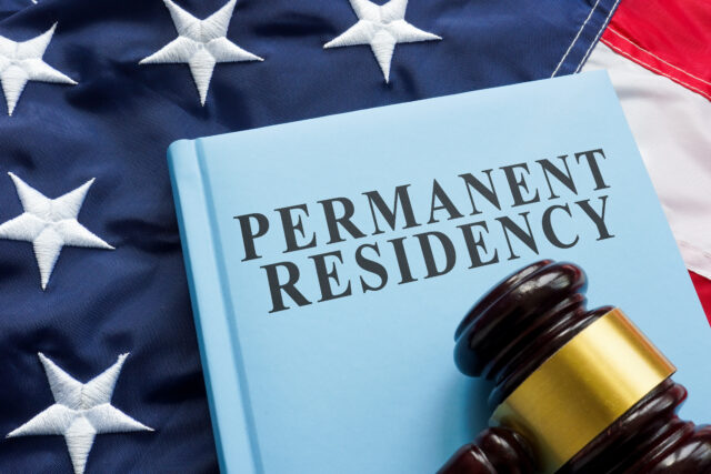 Permanent residency law book on the flag.