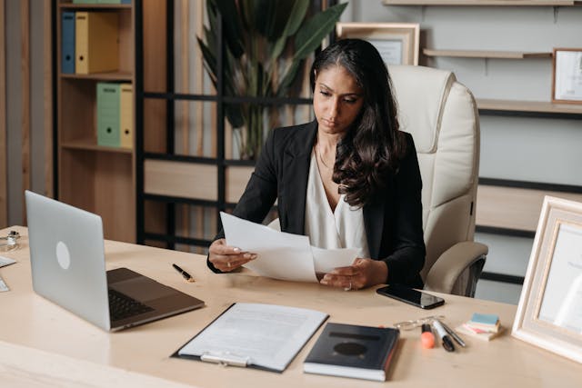 employee in office looking at files